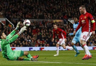 Manchester United's Wayne Rooney scores their first goal